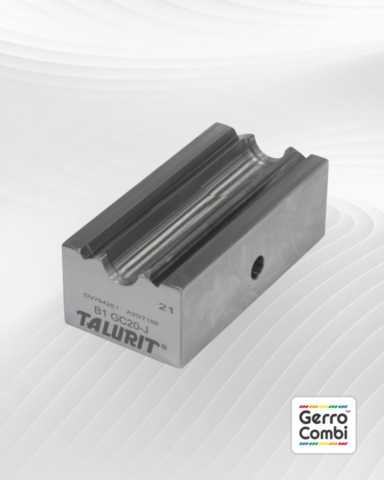 Displayed against a light gray background with subtle wavy lines is a Gerro™ Combi Die, featuring intricate grooves and patterns on its metal surface. This component, used in the mechanical splicing of combination wire rope, bears the Talurit Group logo with "Gerro Combi" in the corner. © Copyright Talurit AB. All rights reserved.