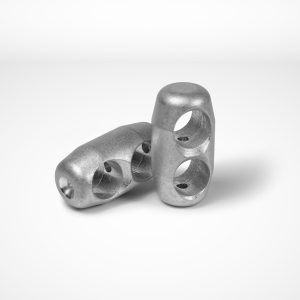 Two parallel-joint ferrules used in combination wire rope equipment, are shown against a plain white background. Each clamp features two cylindrical holes running through them. One ferrule stands upright, while the other lies down at an angle. © Copyright Talurit AB. All rights reserved.