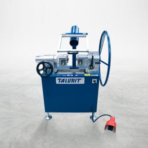 A blue and silver AV 45 - Annealing Machine branded "Talurit®" stands against a plain white background. This wire rope cutting equipment features large wheels, levers, and a foot pedal connected to its base, designed for efficientl annealing of wire rope. © Copyright Talurit AB. All rights reserved.