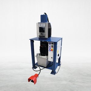 Talurit® A blue LK 45 1VS Cutting Machine by the Talurit Group, designed for wire rope equipment, featuring a cylindrical motor and control panel with various buttons and switches. It includes a red foot pedal positioned on the floor in front of the machine against a plain white background. © Copyright Talurit AB. All rights reserved.