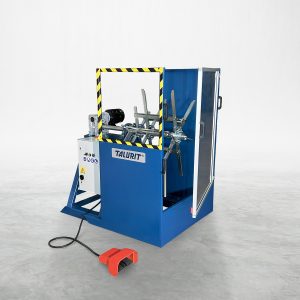Talurit® The image shows a blue machine designed for the mechanical splicing of wire rope, with a yellow-and-black striped frame and a brand label "TALURIT" on its side. A red foot pedal connected by a black cable is on the floor in the foreground. The machine is set against a plain white background. © Copyright Talurit AB. All rights reserved.