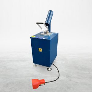 Talurit® The LGK 14 – Annealing Machine, an industrial blue device specialized in the mechanical splicing of wire rope, features a tall, angled chute and a control panel with several buttons. A black cable extends to a red foot pedal. Set against a plain white background, this piece of wire rope equipment is adorned with various warning symbols. © Copyright Talurit AB. All rights reserved.