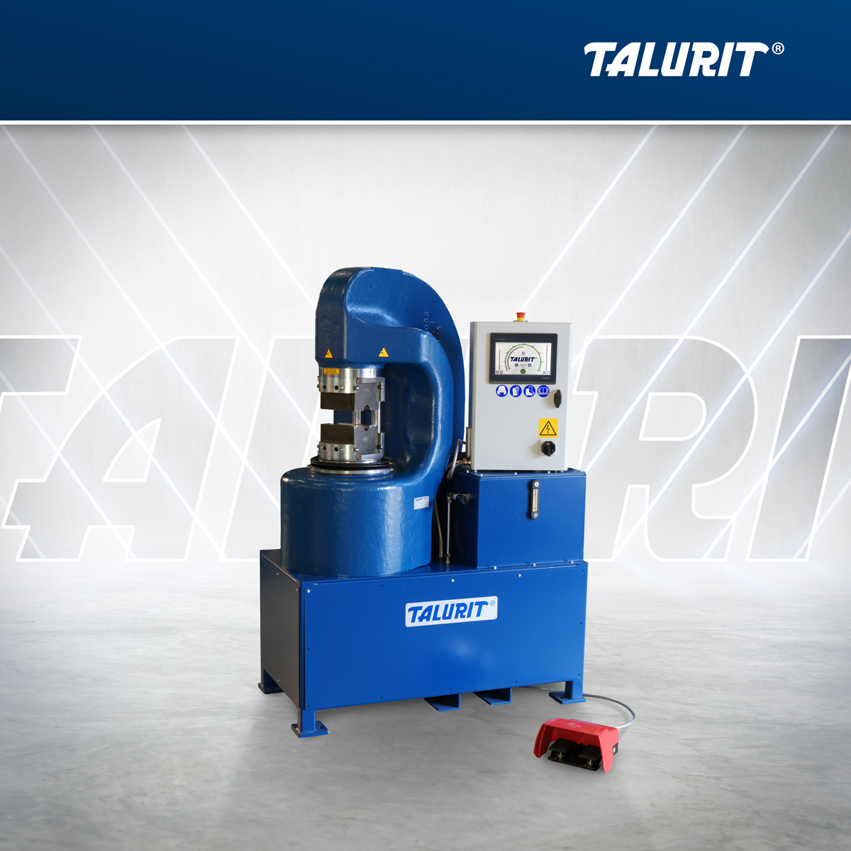 Talurit® A blue industrial swaging machine with a digital control panel, emergency stop button, and foot pedal. The brand name TALURIT is displayed on the machine and in the background. © Copyright Talurit AB. All rights reserved.
